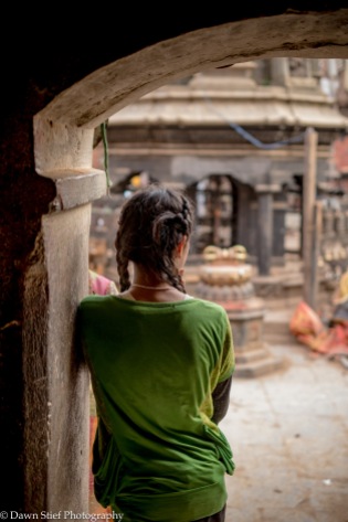 Girl at the entry of the temple